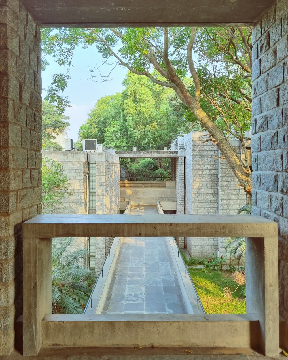 a bench sitting in the middle of a courtyard