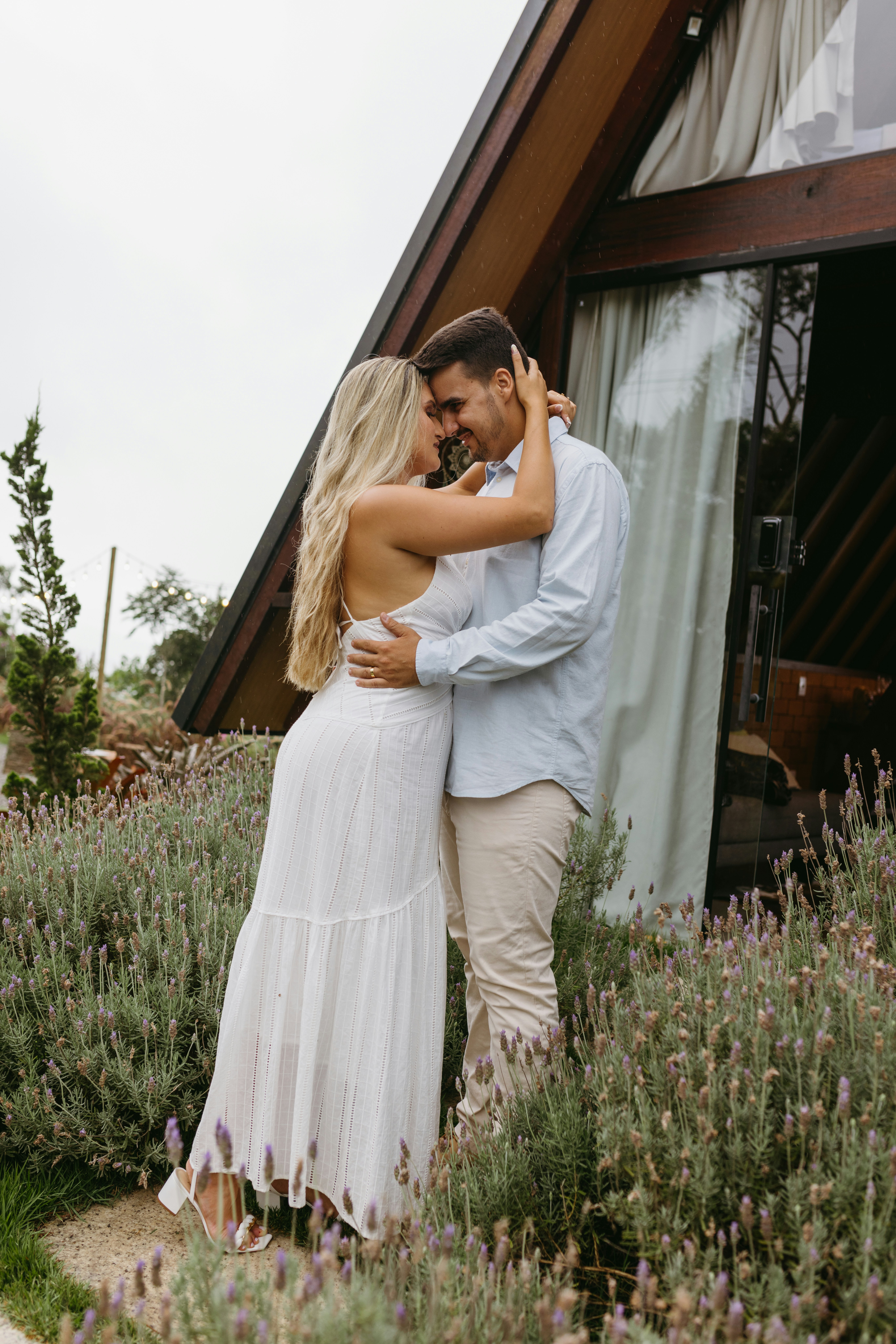 a man and a woman embracing in a field of lavender