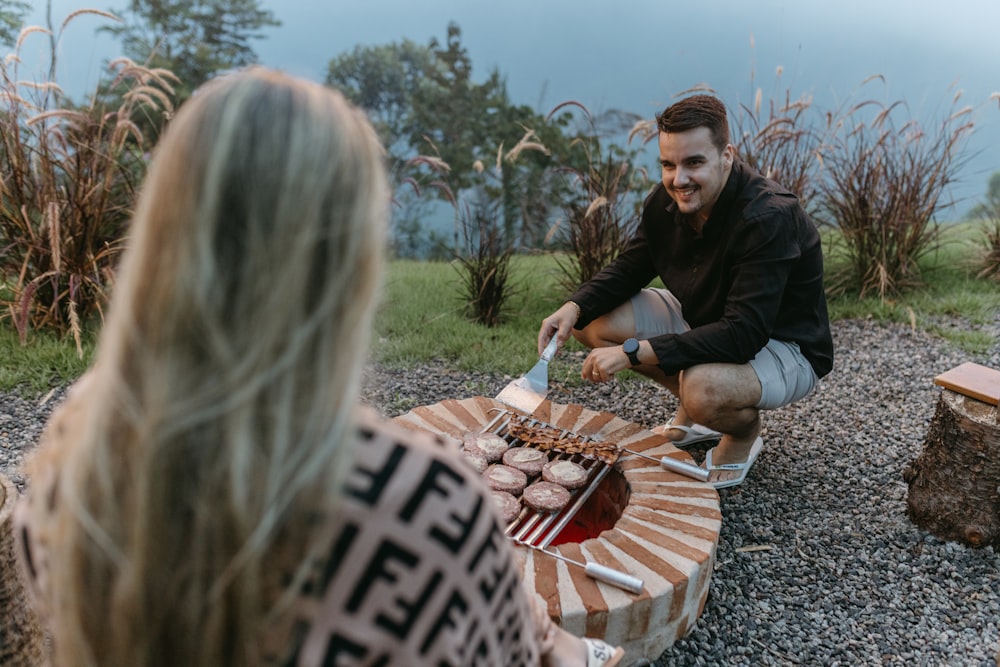 a man sitting on a bench next to a woman