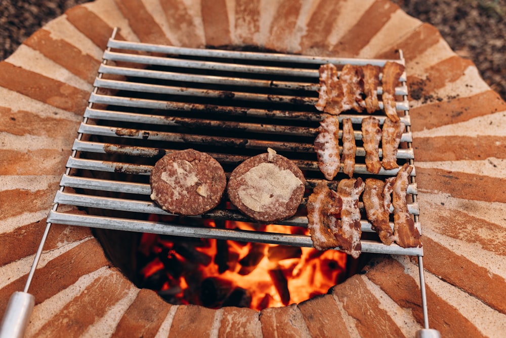 a grill with donuts cooking on it