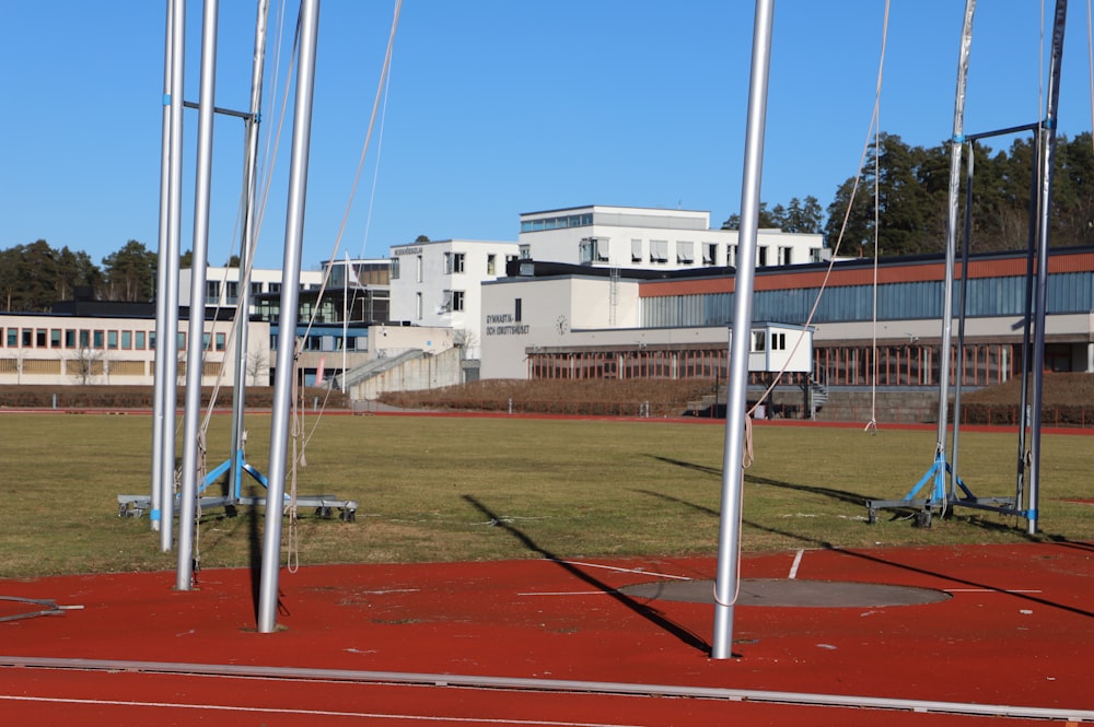 a field with a building in the background