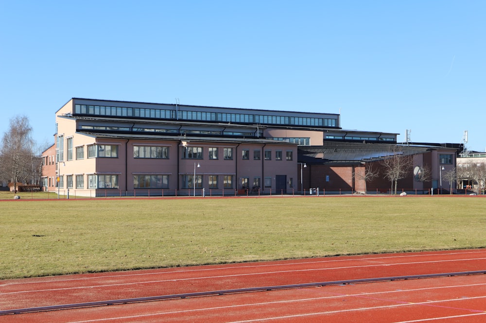 a building with a grassy field in front of it