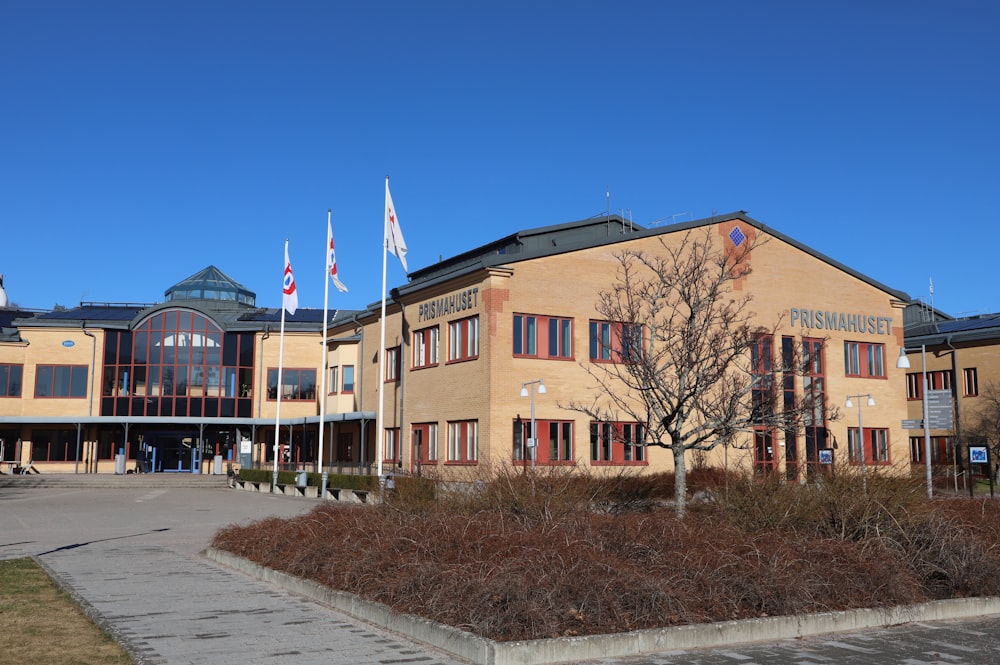 a large building with a lot of flags on top of it