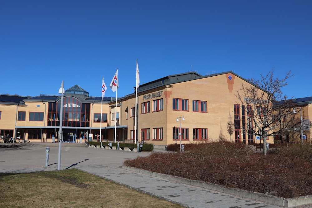 a building with flags flying in front of it