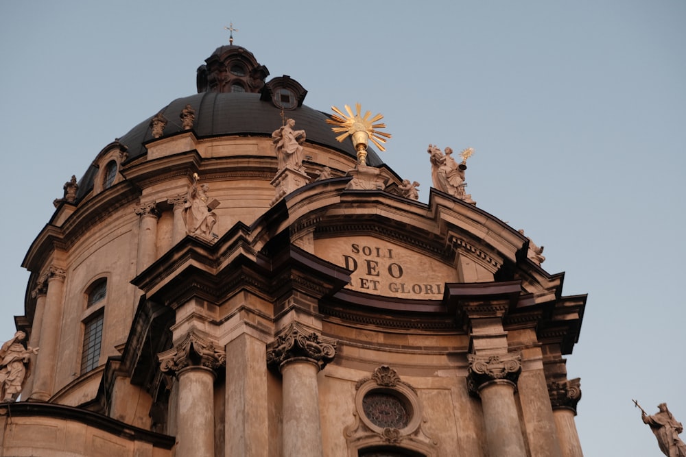 a large building with statues on top of it