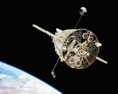 a satellite in orbit with the earth in the background