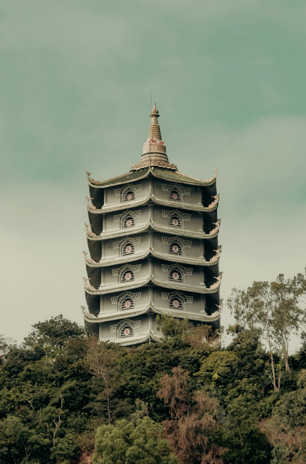 a tall tower with a clock on the top of it