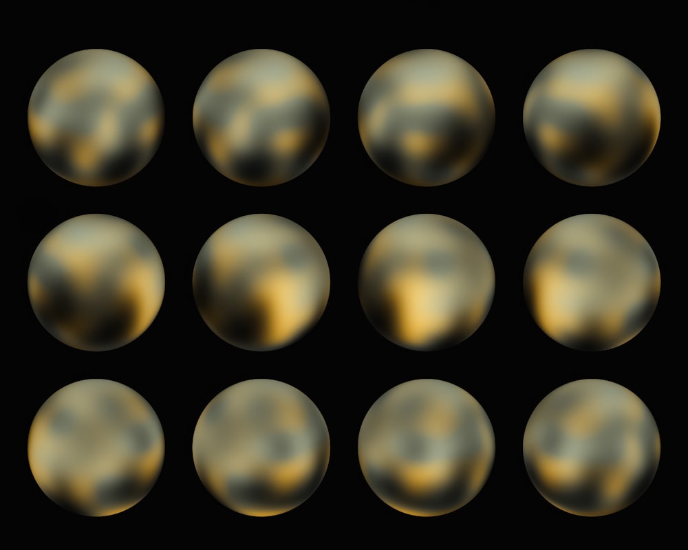 a set of nine shiny balls on a black background