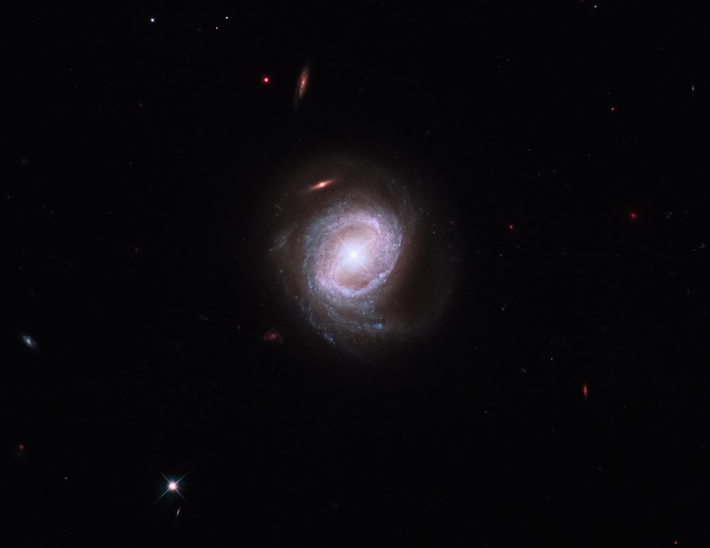 a spiral shaped object in the dark sky