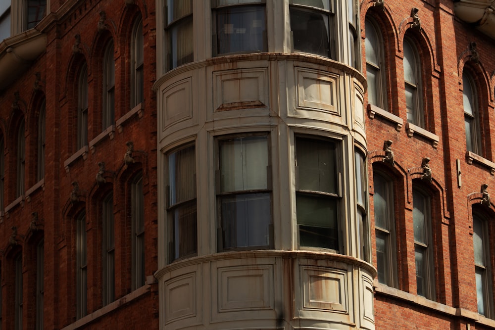 a tall brick building with lots of windows