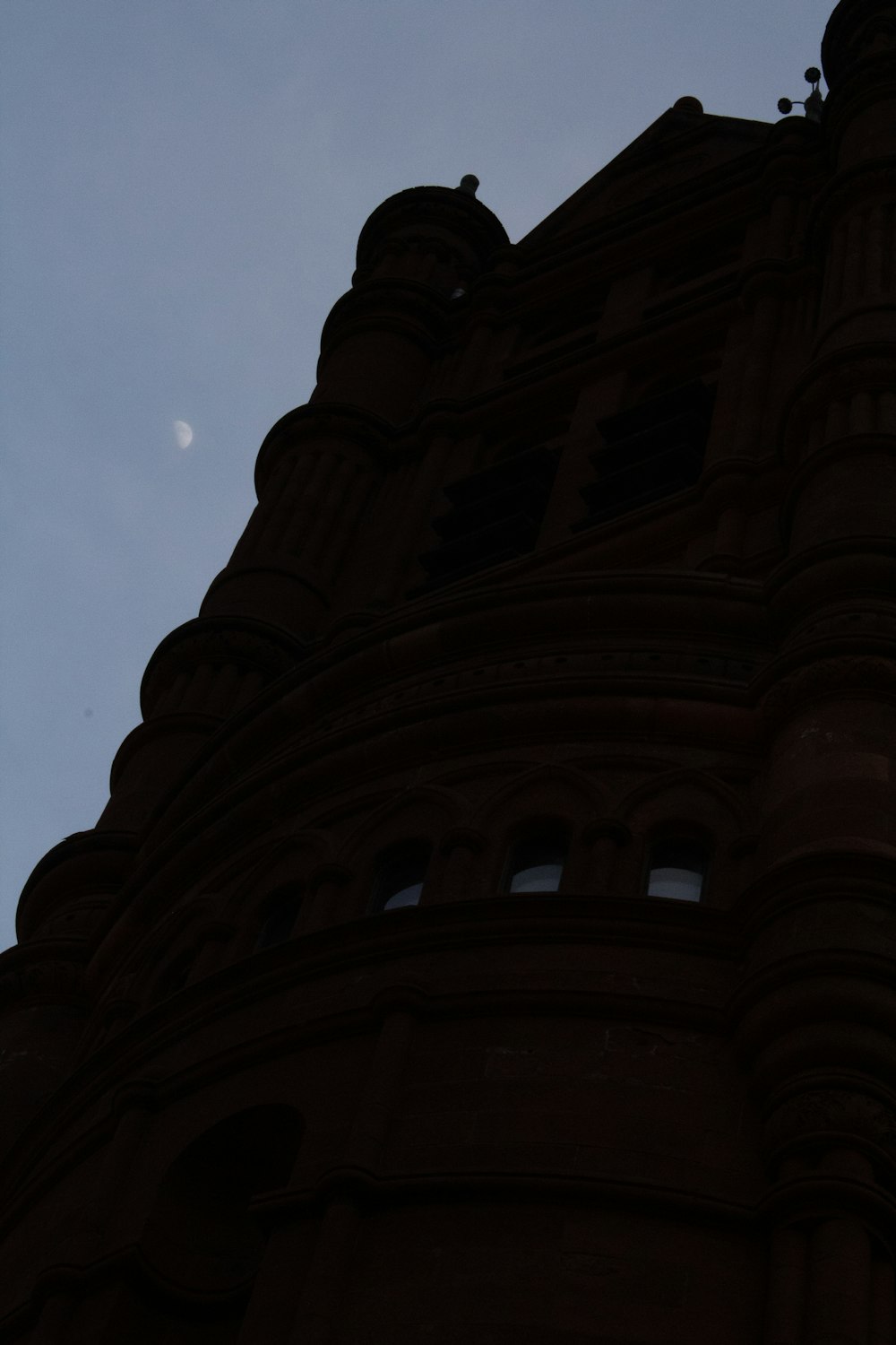 a tall building with a clock on the side of it