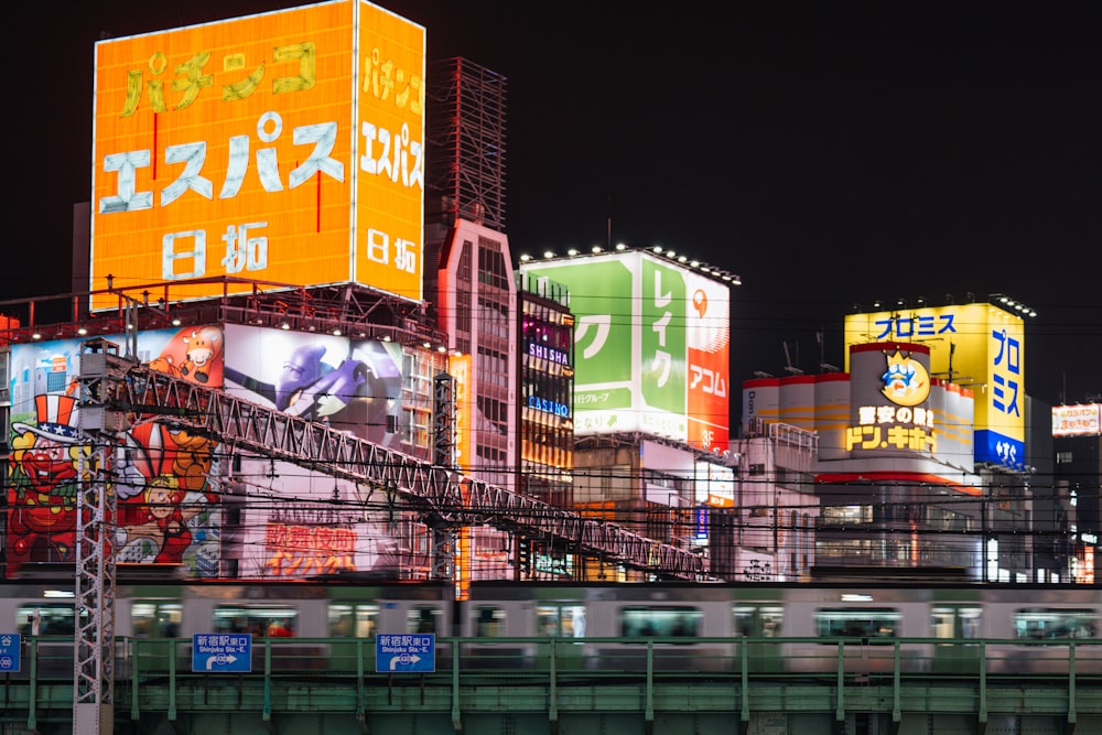 a train traveling past a city at night