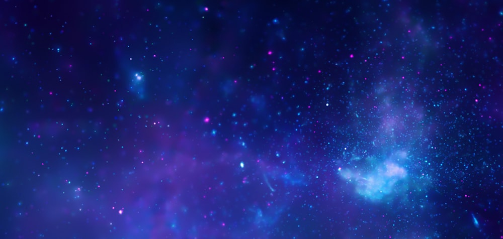 a blue and purple space filled with stars