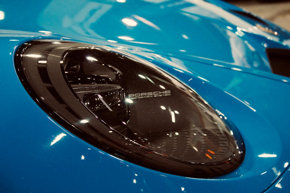 a close up of a blue sports car door handle