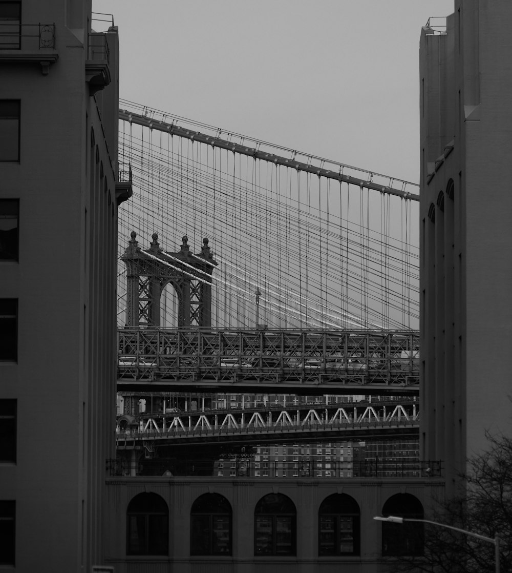 a black and white photo of the brooklyn bridge