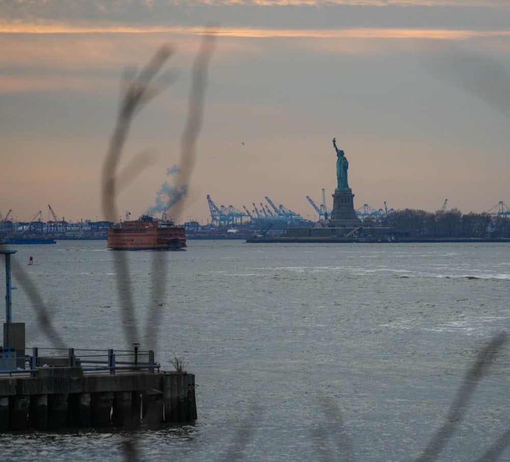 a view of the statue of liberty from across the water