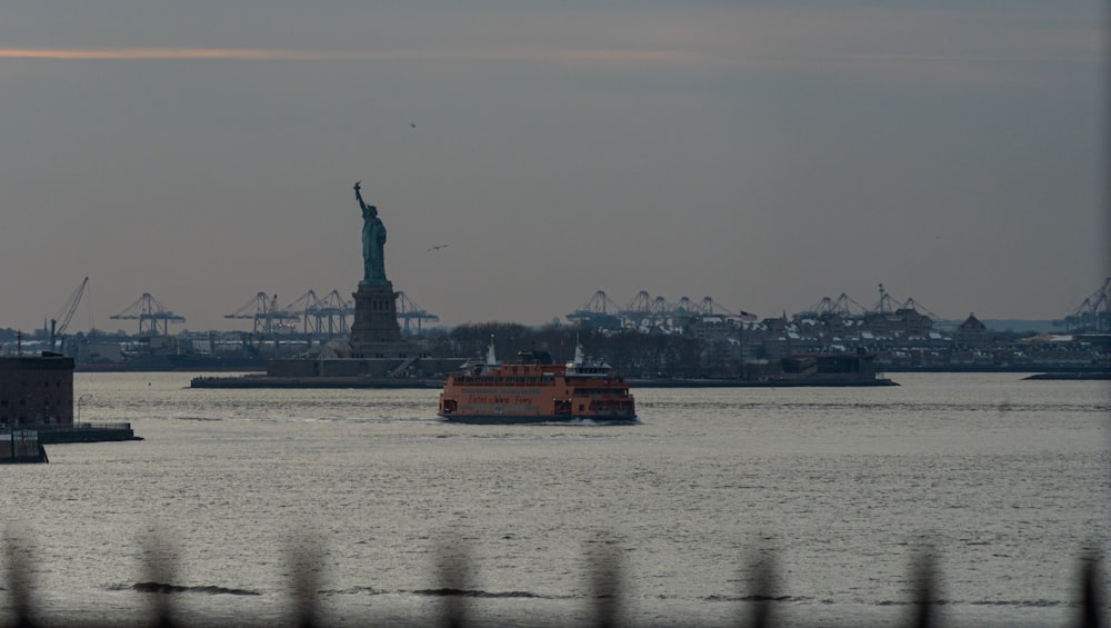 the statue of liberty is seen from across the water