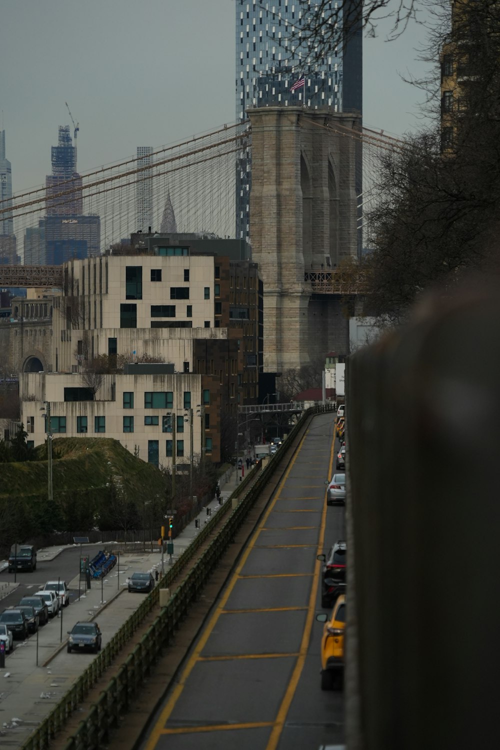 a view of a city with a bridge in the background