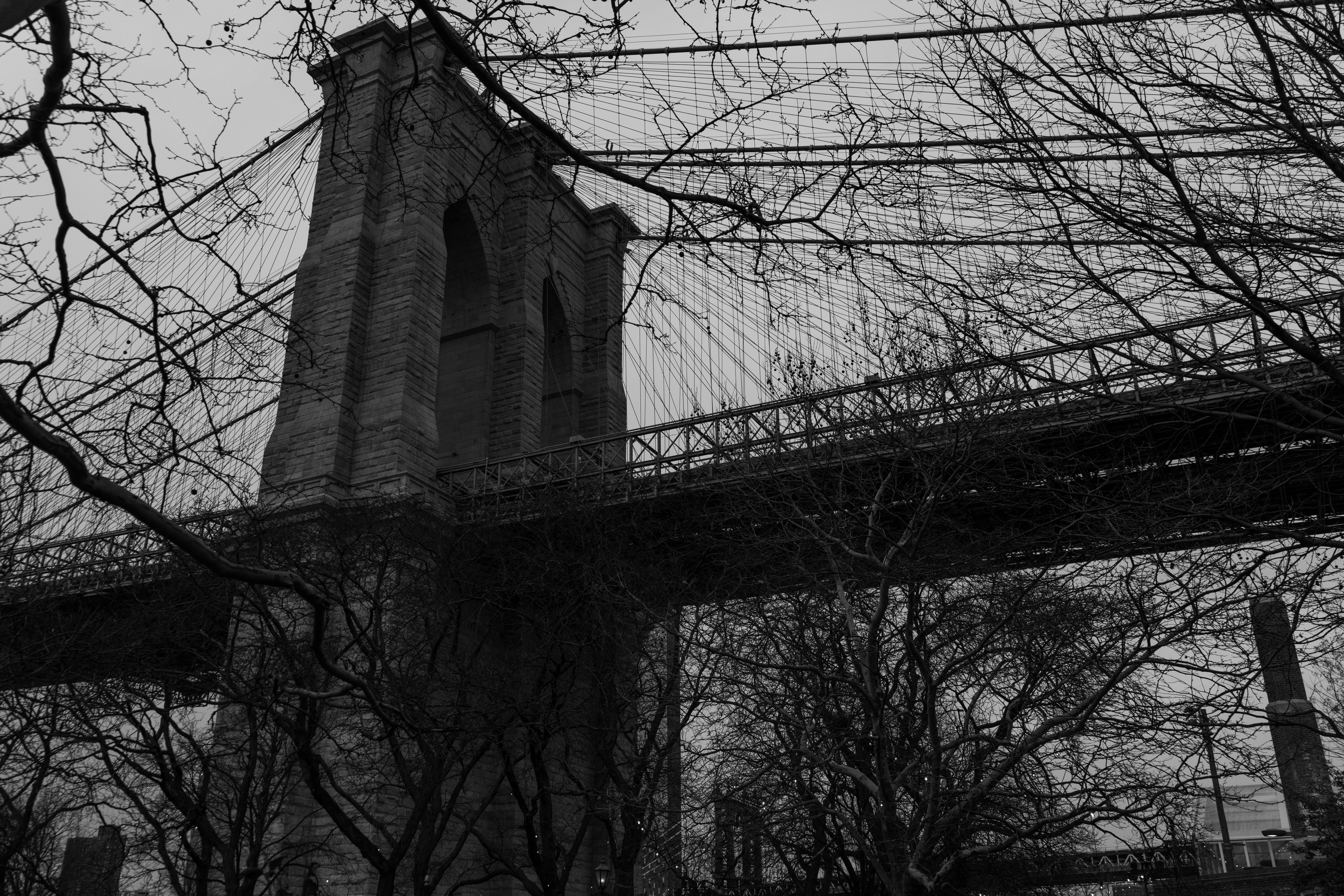 a black and white photo of the brooklyn bridge