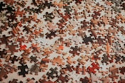 a close up of a puzzle on a table