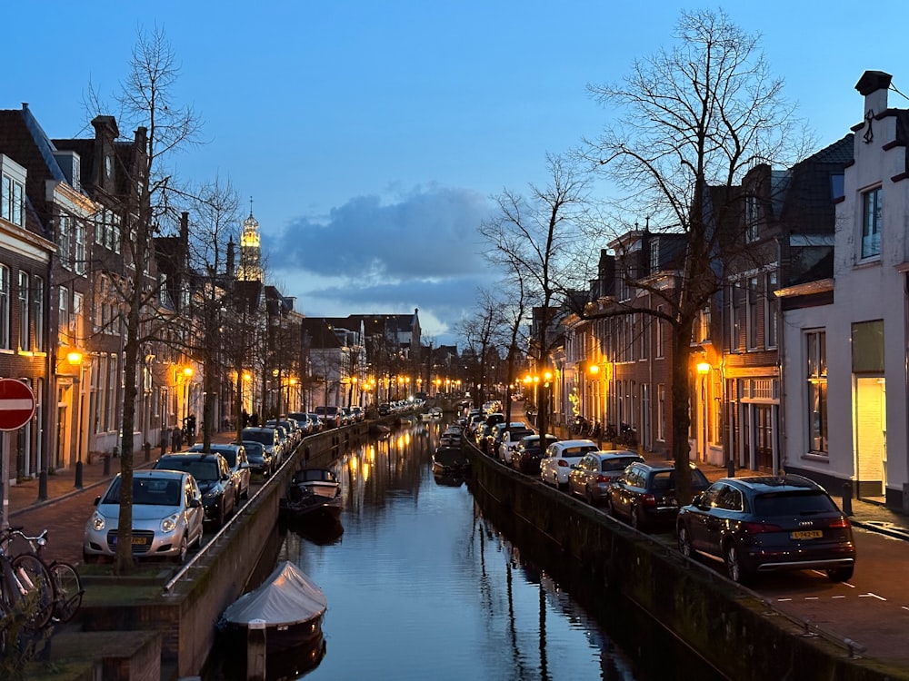 a canal that has cars parked along it