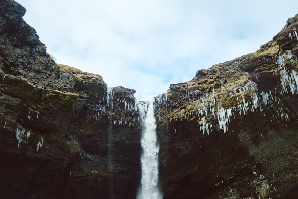 a waterfall with icicles on the side of it