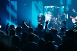 a group of people that are standing in front of a stage