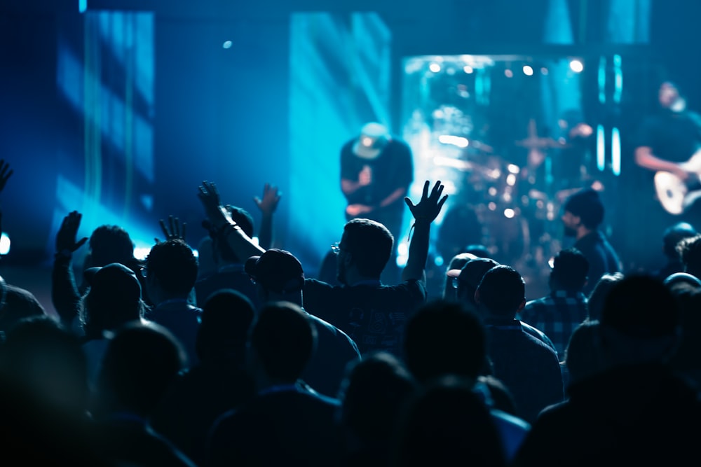 a group of people that are standing in front of a stage