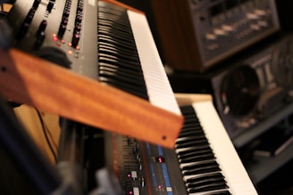a close up of a keyboard with many knobs