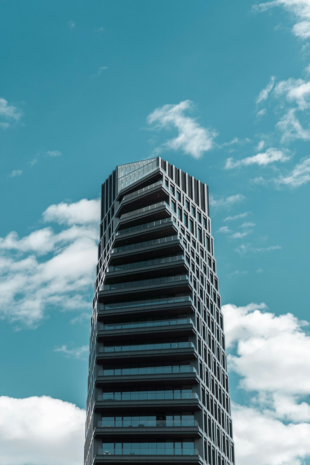 a very tall building with a sky background