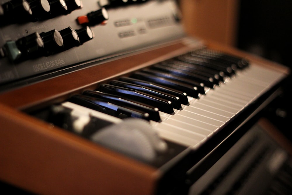 a close up of a keyboard with many knobs