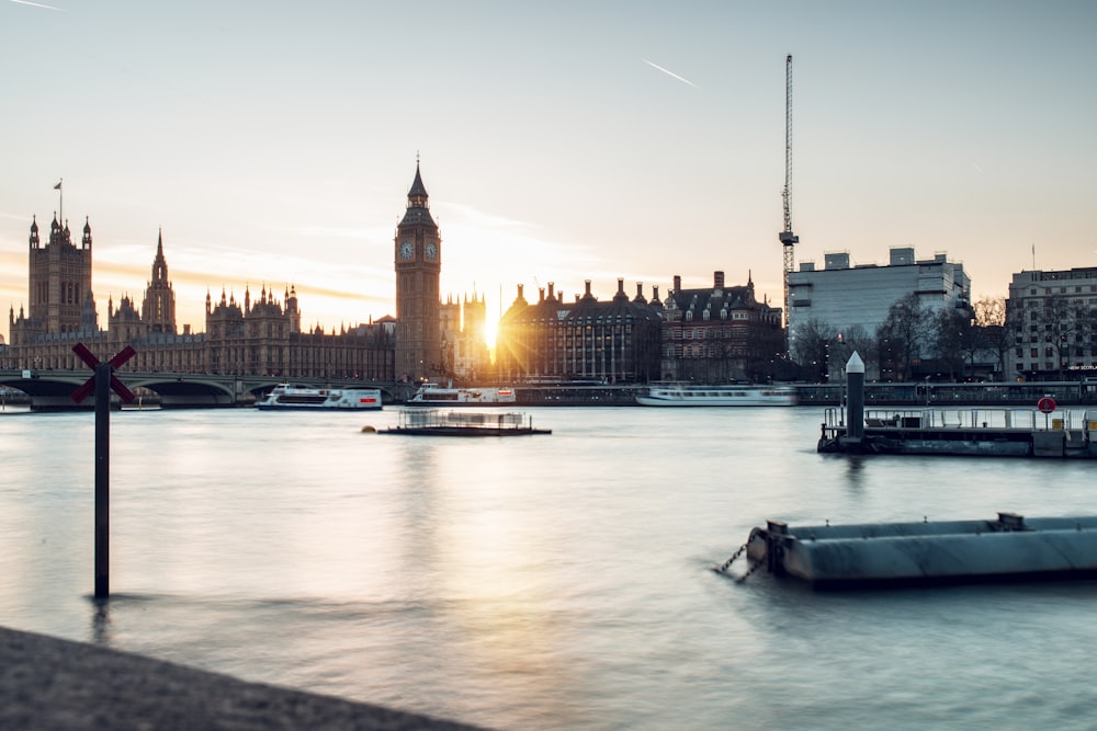 the sun is setting over the city of london