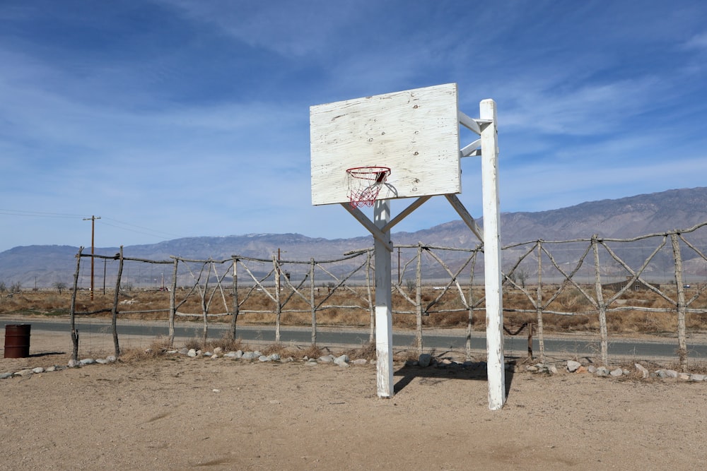 a basketball hoop in the middle of a desert