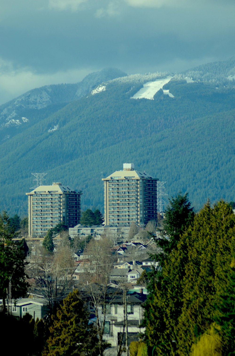 a view of a city with mountains in the background