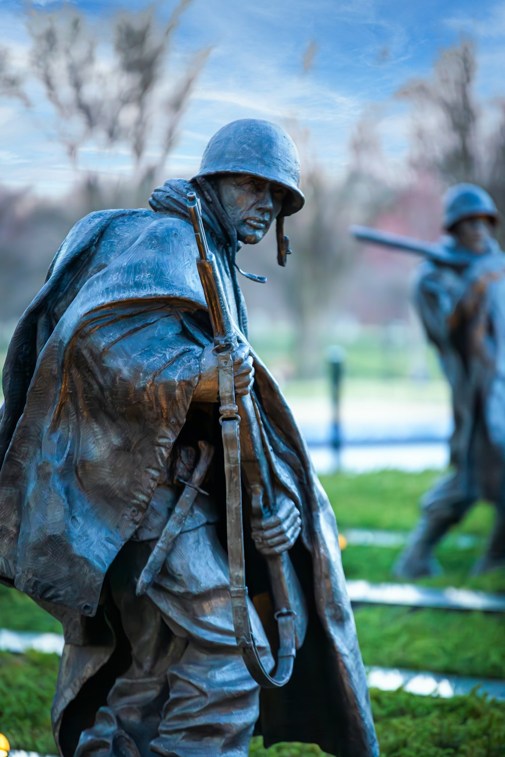 a statue of a soldier holding a rifle