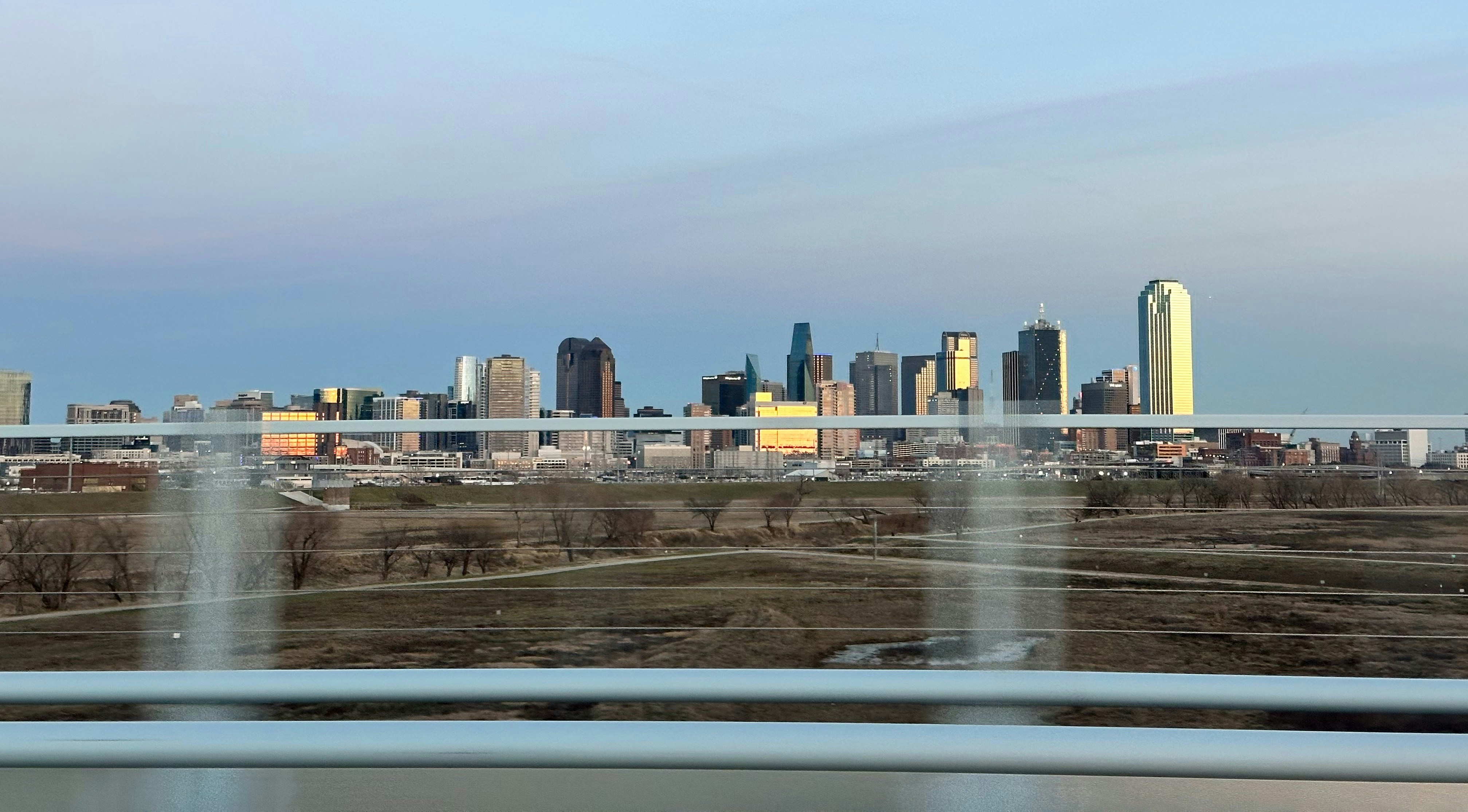 a view of a city from a moving vehicle
