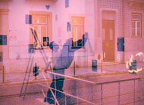 a blurry image of a person standing in front of a building