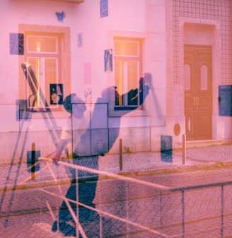 a blurry image of a person standing in front of a building