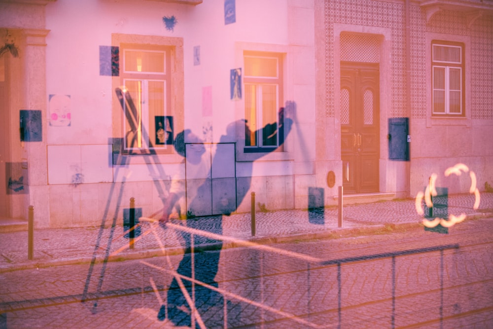 a blurry image of a person standing in front of a building