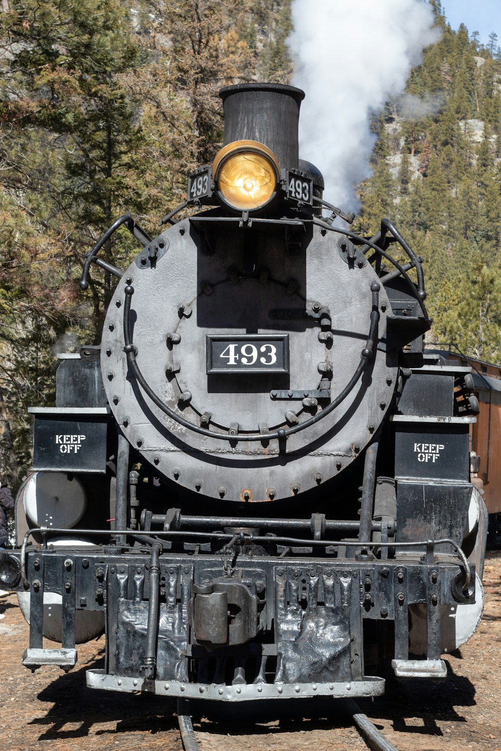 a train engine with smoke coming out of it