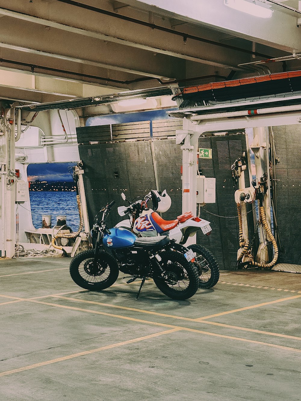 a motorcycle parked in a parking lot next to a building