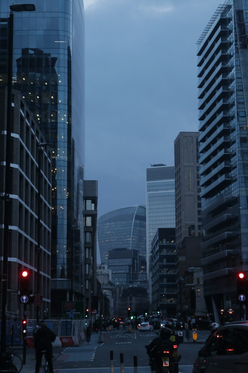 a city street filled with lots of tall buildings