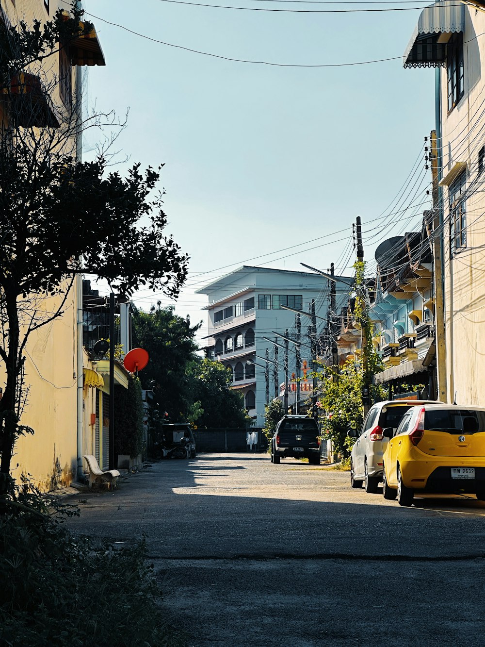 a yellow car parked on the side of a road