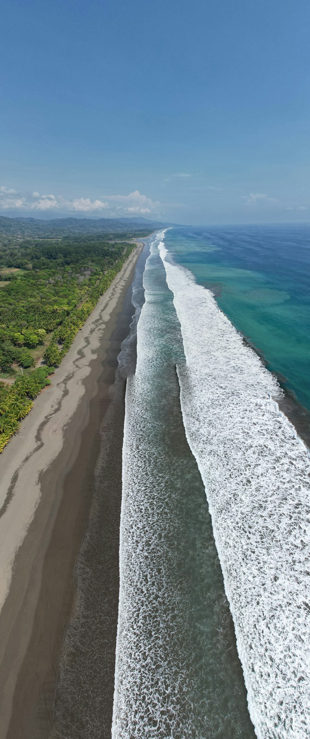 an aerial view of a beach and ocean