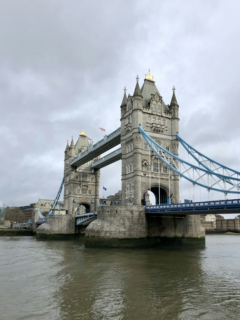 a bridge that has a tower with a clock on it