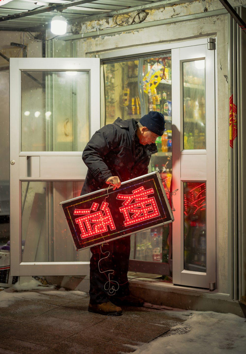 a man is holding a sign that says exit