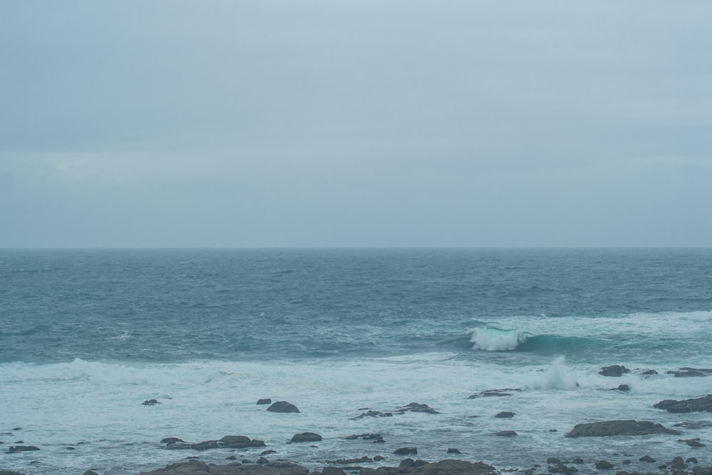 a large body of water with a wave coming in