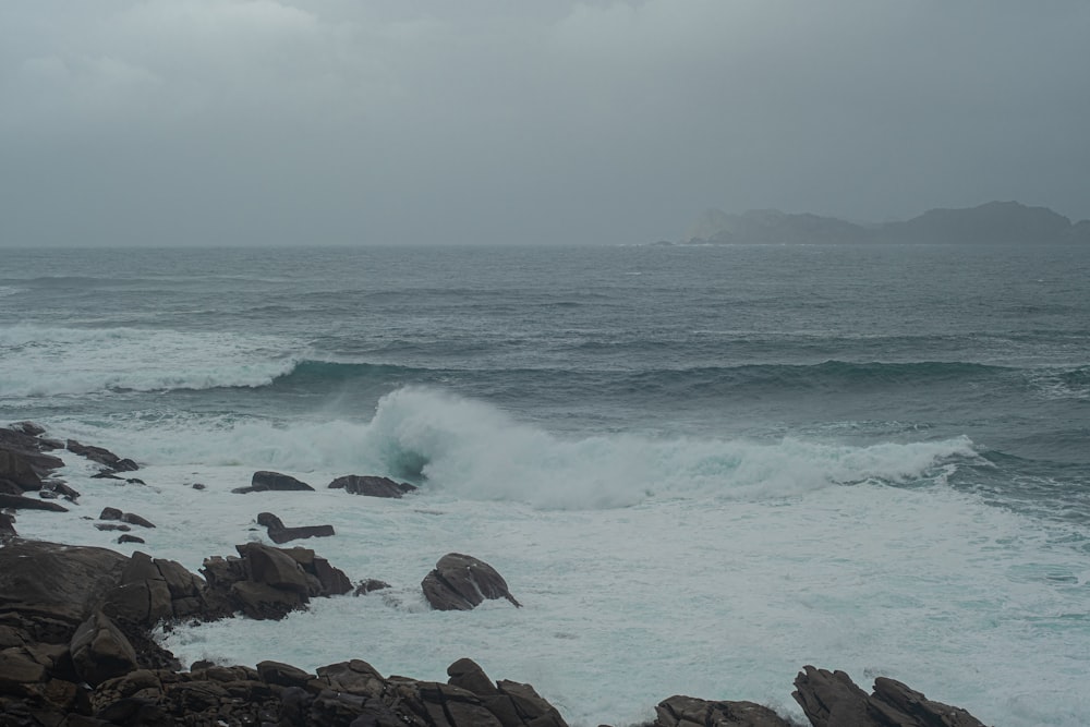 a large body of water surrounded by rocks