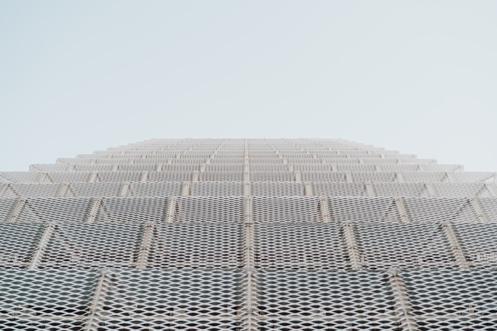 a very tall building with a sky background