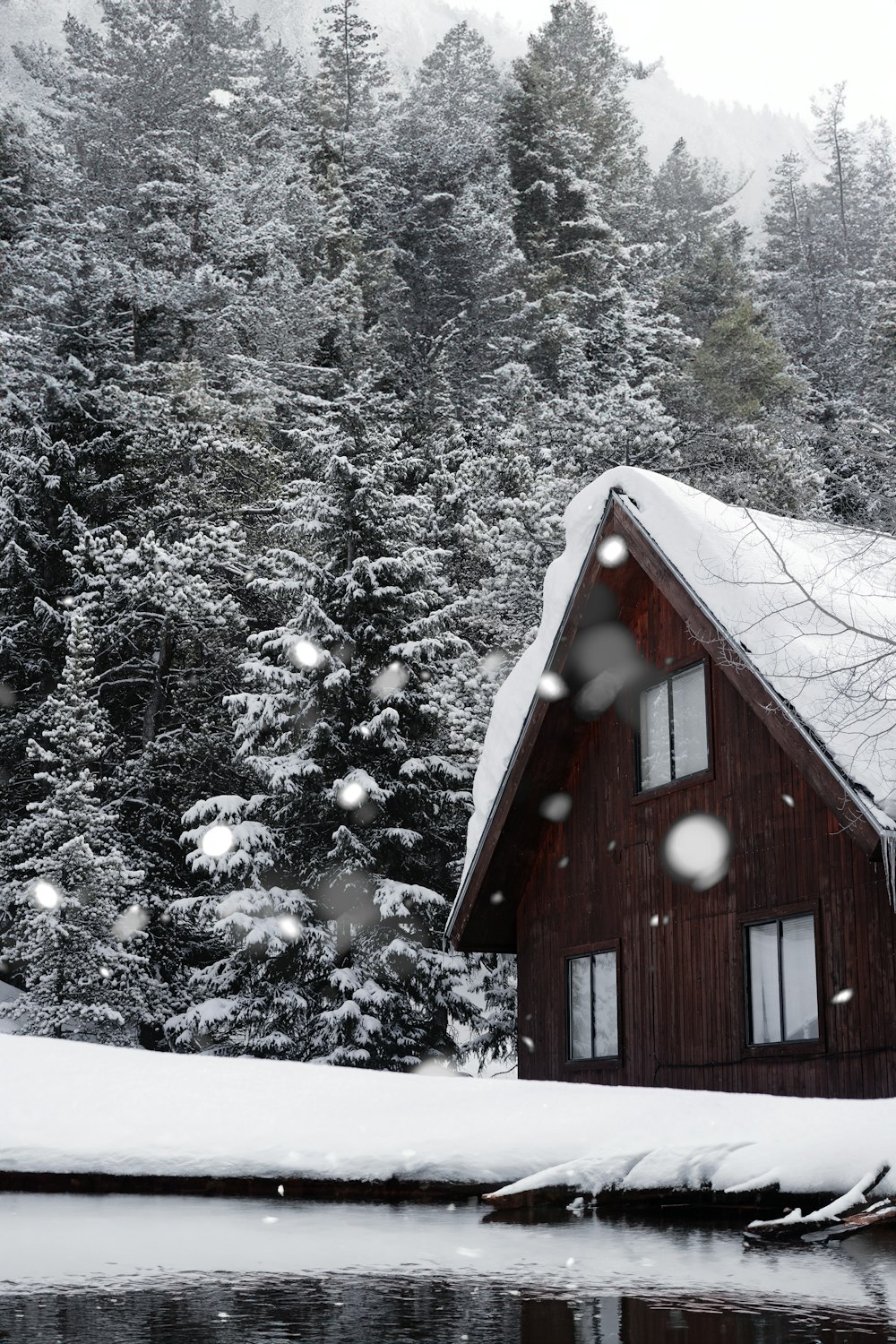 a cabin in the woods is covered in snow